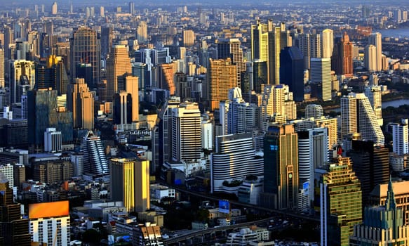 Modern skyscraper city streets in the evening,Bangkok,Thailand