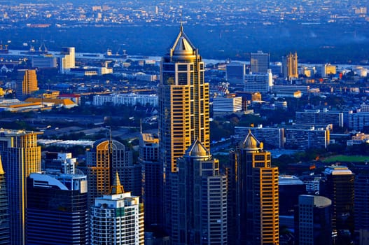 Modern skyscraper city streets in the evening,Bangkok,Thailand