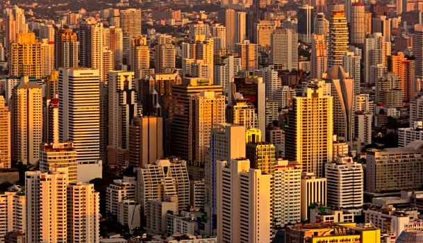 Modern skyscraper city streets in the evening,Bangkok,Thailand