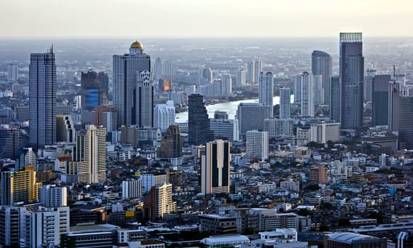 Modern skyscraper city streets in the evening,Bangkok,Thailand
