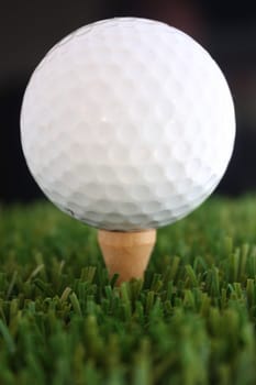 Golf Ball on tee in grass
