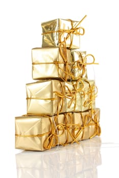 Gold gift wrapped parcels in a pyramid