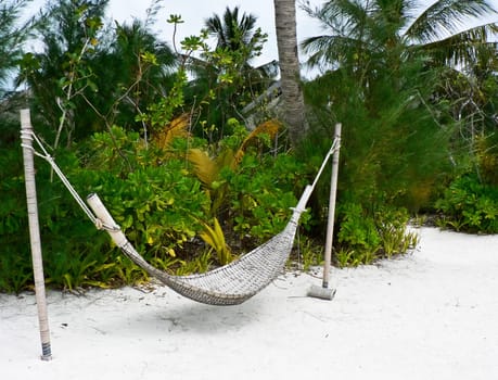 photo of the hammock on the tropical beach of maldives island