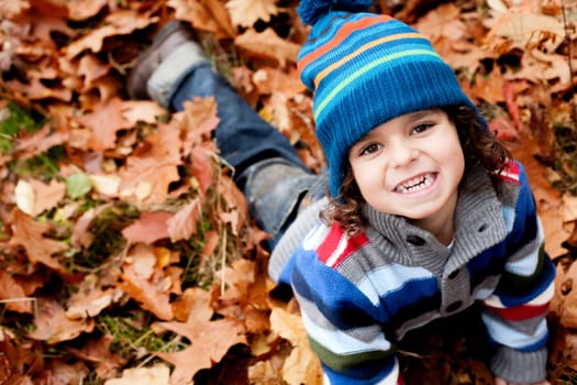 Happy child in the forest is having fun