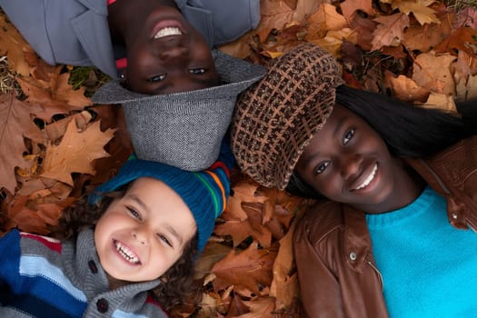 Happy family with foster children in the forest