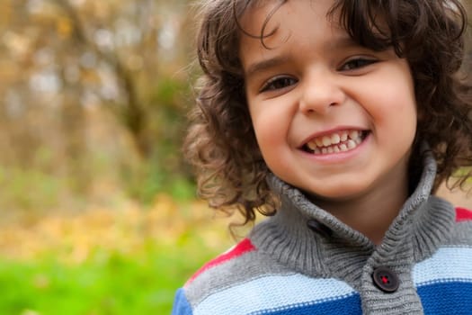 Happy child in the forest is having fun