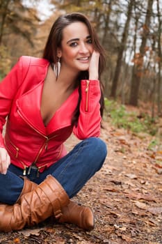 Beauty young woman in the forest is having a nice time