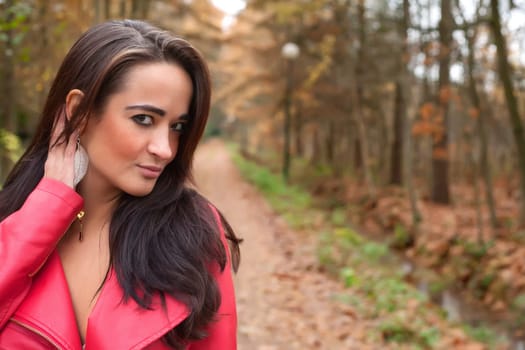 Beauty young woman in the forest is having a nice time