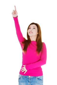 Happy , excited woman pointing on copy space, isolated on white