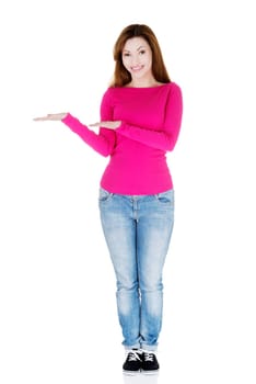 Happy , excited woman presenting copy space on her palm, isolated on white