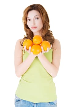 Happy woman with orange fruits, isolated on white