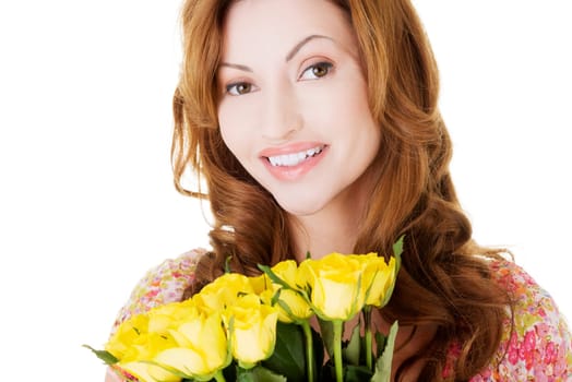 Happy woman with fresh yellow roses.