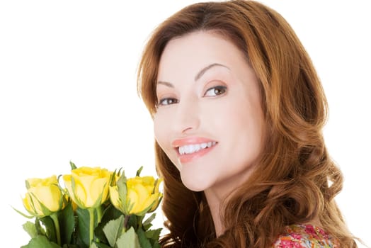 Happy woman with fresh yellow roses.