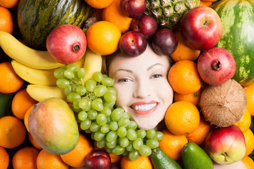 Woman face in fruits, healthy nutrition and diet concept.