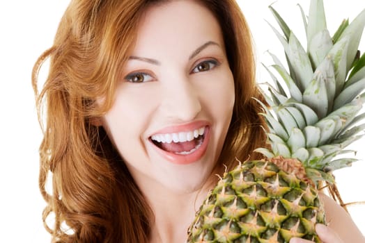 Happy woman with fresh pineapple fruit, isolated on white