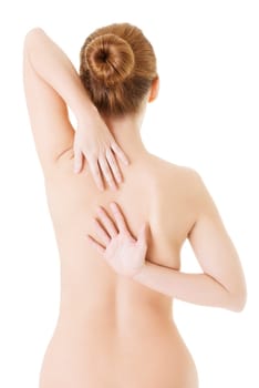Woman with pain in her back. Isolated on white