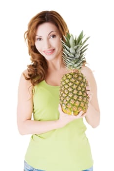 Happy woman with fresh pineapple fruit, isolated on white