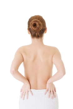 Woman with pain in her back. Isolated on white