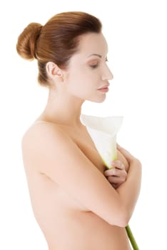 Portrait of beautiful adult woman with health skin and with calla flower