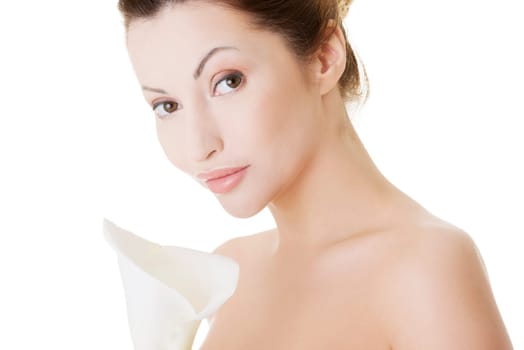 Portrait of beautiful adult woman with health skin and with calla flower
