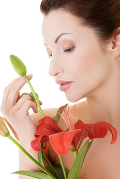 Portrait of beautiful adult woman with health skin and with red lily flower