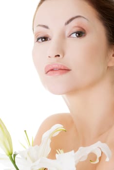 Portrait of beautiful adult woman with health skin and with lily flower