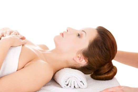 Attractive woman relaxing beeing massaged in spa saloon