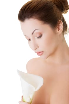 Portrait of beautiful adult woman with health skin and with calla flower