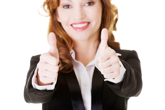 Happy smiling business woman with thumbs up, ok gesture