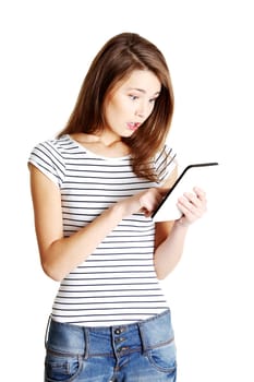 Beautiful young woman using tablet computer , isolated on white