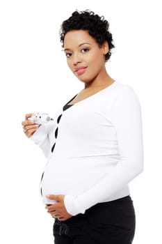 Pregnant woman holding a toy airplane