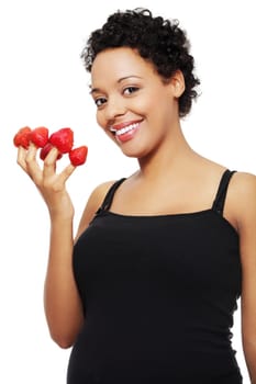 Young happy pregnant afro american woman with strawberries, isolated on white background