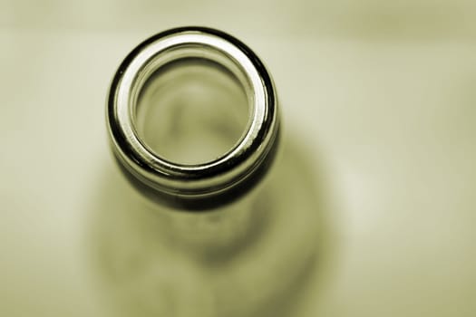 The close-up of a bottle opening.