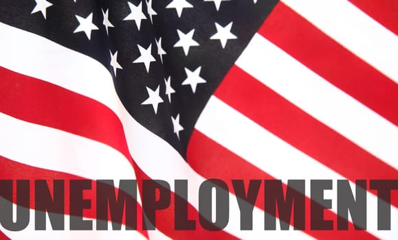 the word 'unemployment' on a USA flag