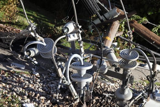 parts of a power pole on the ground after an auto accident