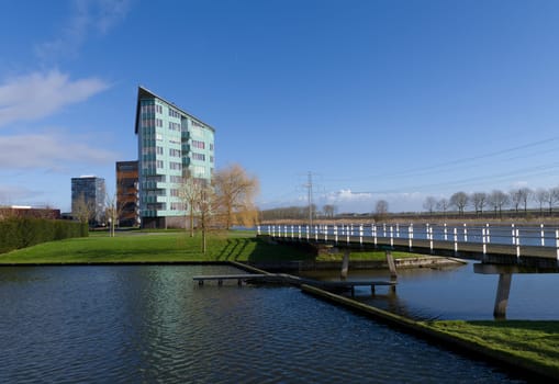 modern apartments along a canal in Almere, netherlands
