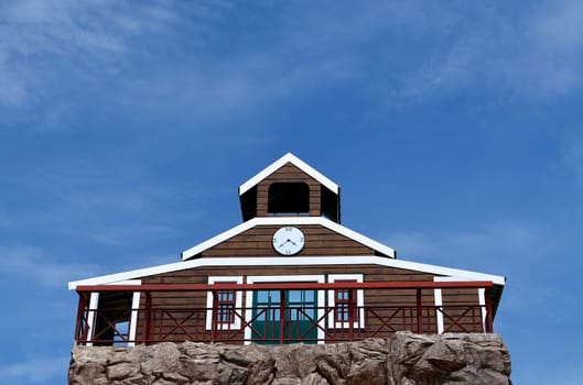 Clock house and blue sky