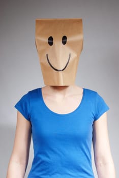 a person with a happy looking paper bag on its head