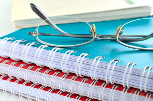 notebook with glasses