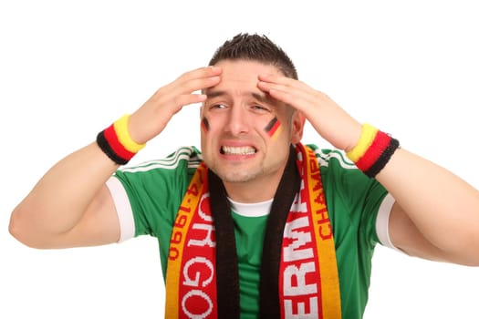 A Germany fan stands there and makes a panicked facial expression,as if a goal has been conceded.