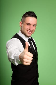 Business man with thumbs out towards the camera.