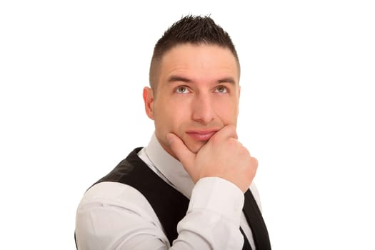 Photo of a thoughtful businessman with his hand on his chin in deliberation.