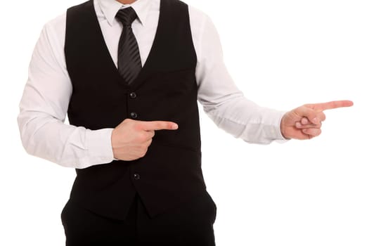 The photo shows an upper body of a man pointing his index fingers to the side.
