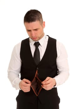 Business man stands there with an empty,open wallet and looks into it in dismay.
