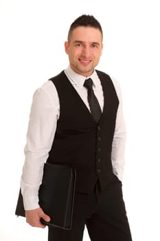 A businessman stands in front of the camera with an application folder and looks friendly into it.
