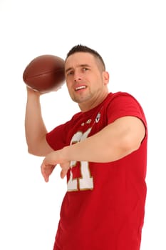 The photo shows a football player who wants to throw the ball and looks excitedly into the distance.