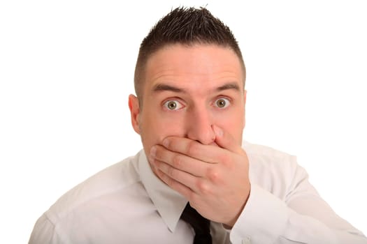 Portrait photo of a businessman who is frightened and holds his hand in front of his mouth and widens his eyes.