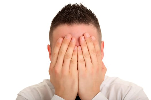Portrait photo of a young man with his hands in front of his eyes