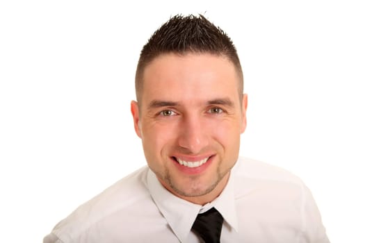 Portrait photo of a young businessman looking kindly at the camera.