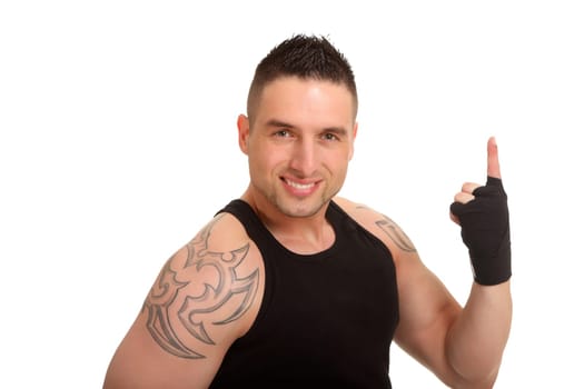 A young athlete raises his index finger in warning and looks kindly into the camera
